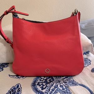 Kate Spade crossbody bag strap. Bright pink pebbled leather, navy interior